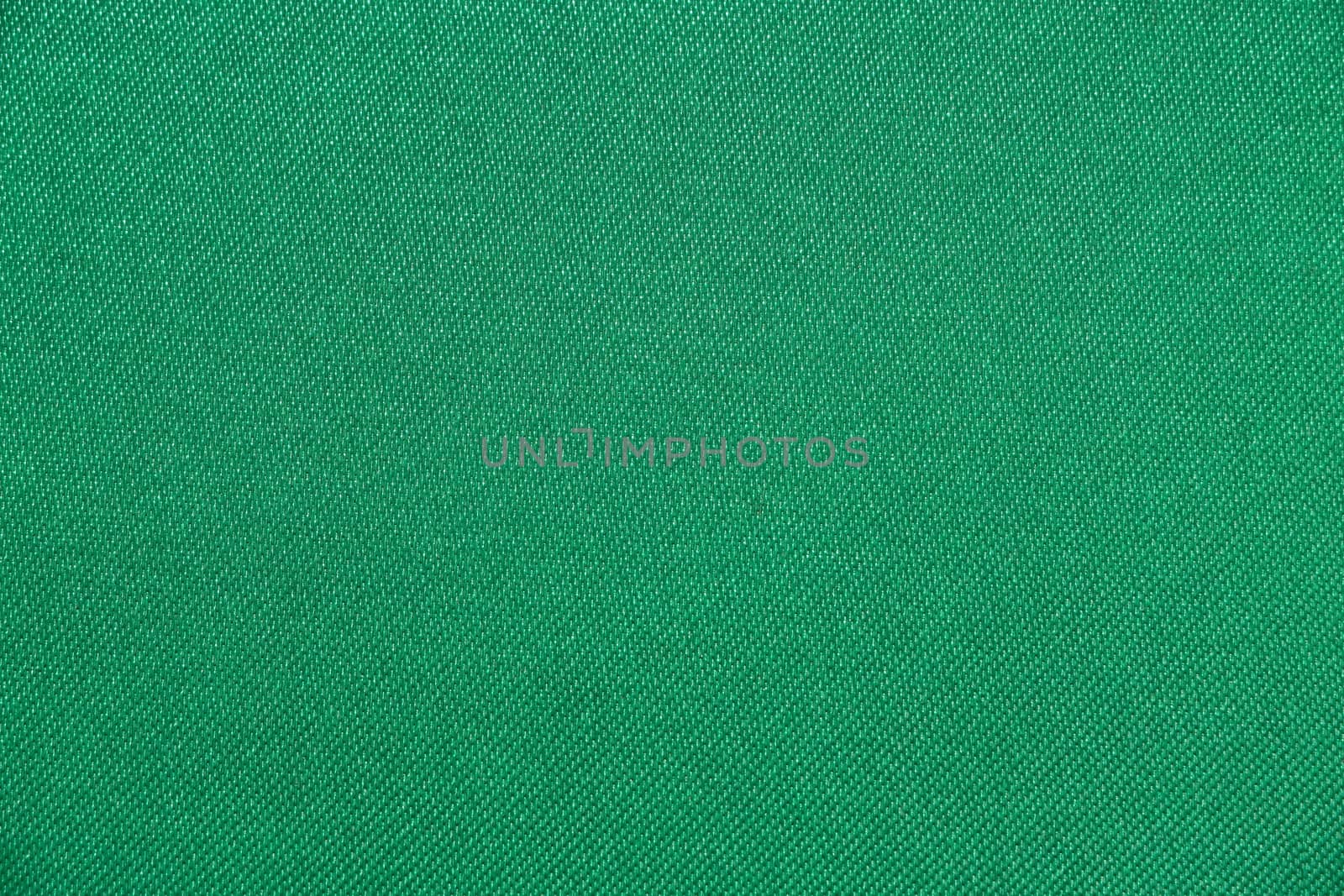 Texture of fabric green color has smooth surface, abstract background.