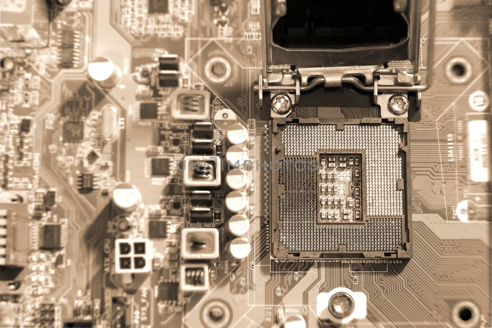 Electronic circuit boards on brown background with CPU socket, selective focus