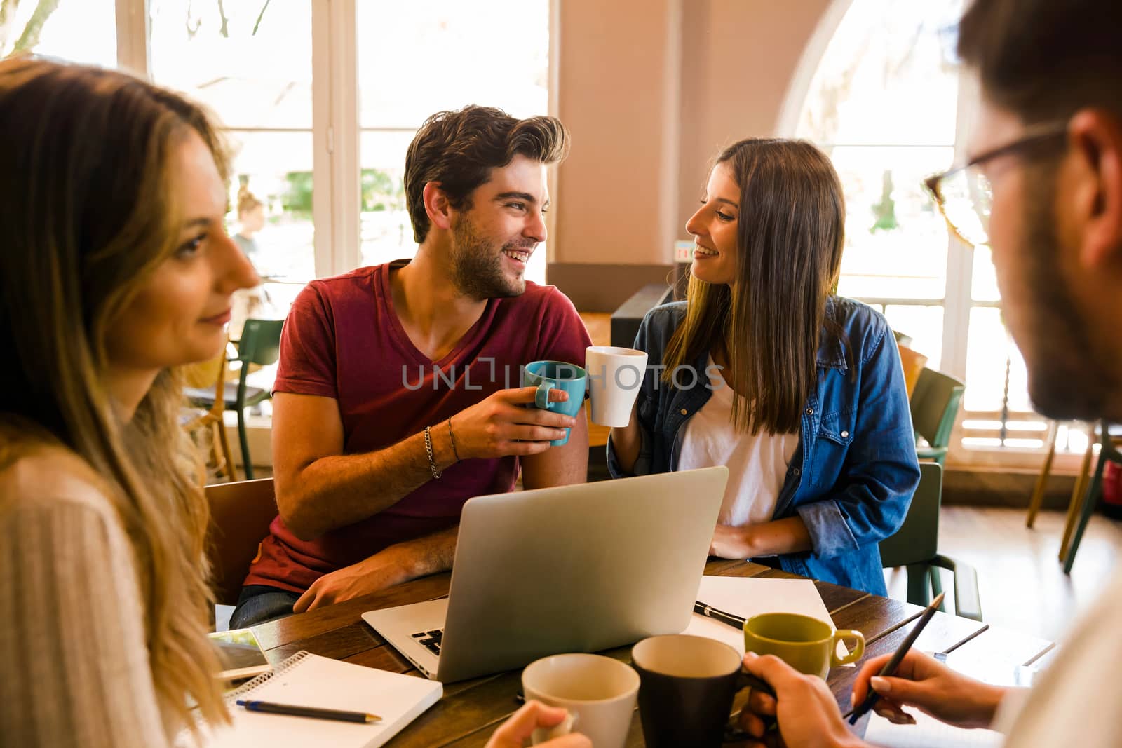 Group of friends studying together and having a good time 