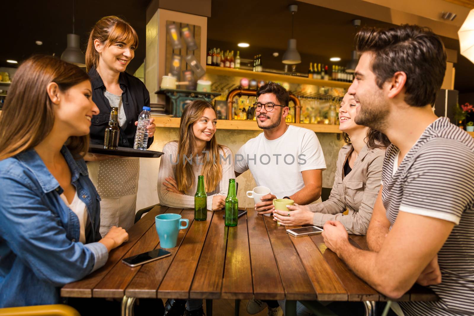 A group of friends making a order at cafe 