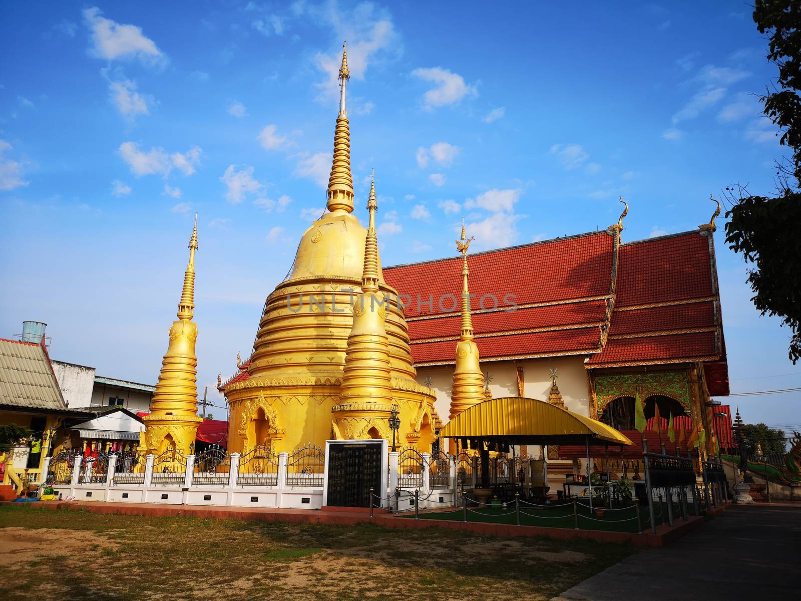 temple and blue sky in chiang rai Thailand by Wmpix