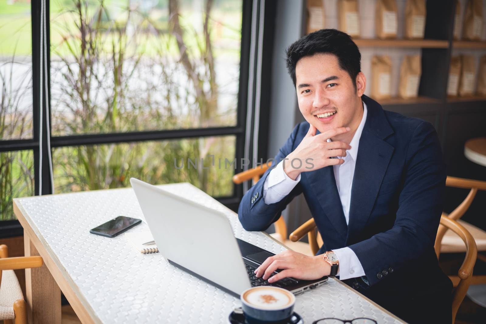 Businessman working on desk office business by Wmpix