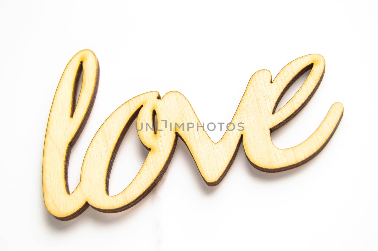 Wooden word love on a white ISOLATED background.