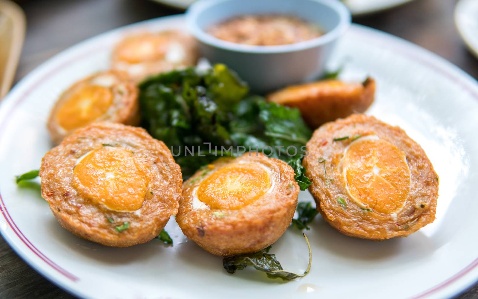 stir-fried basil leave with fried preserved egg. thai food.