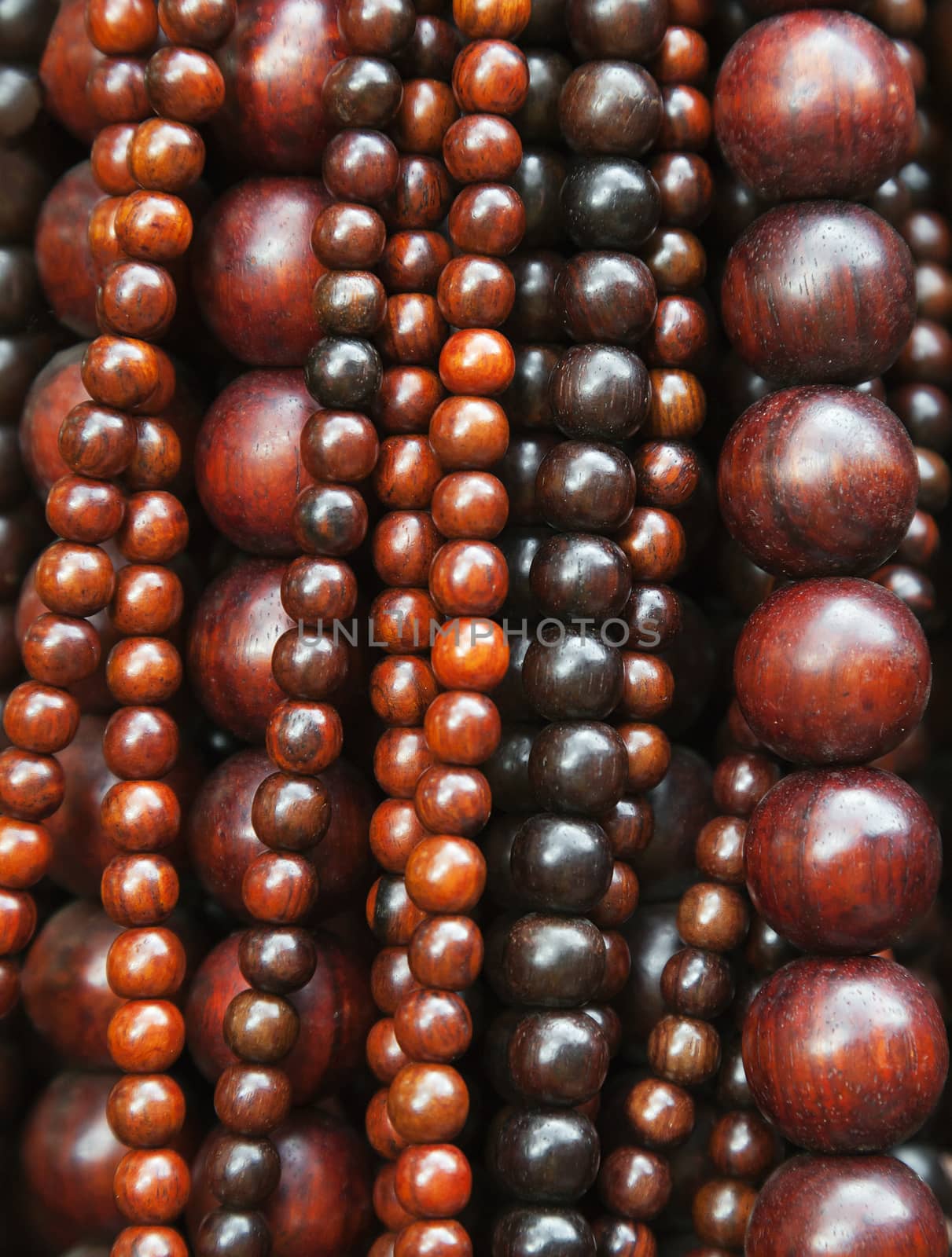 Close-up of various-sized strings of wooden beads