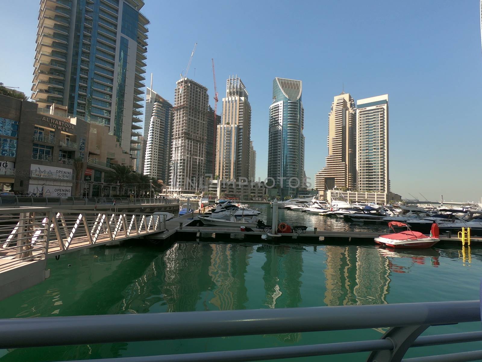 Yachts, Boats parked in Dubai Marina with view of Dubai Marina Skyline