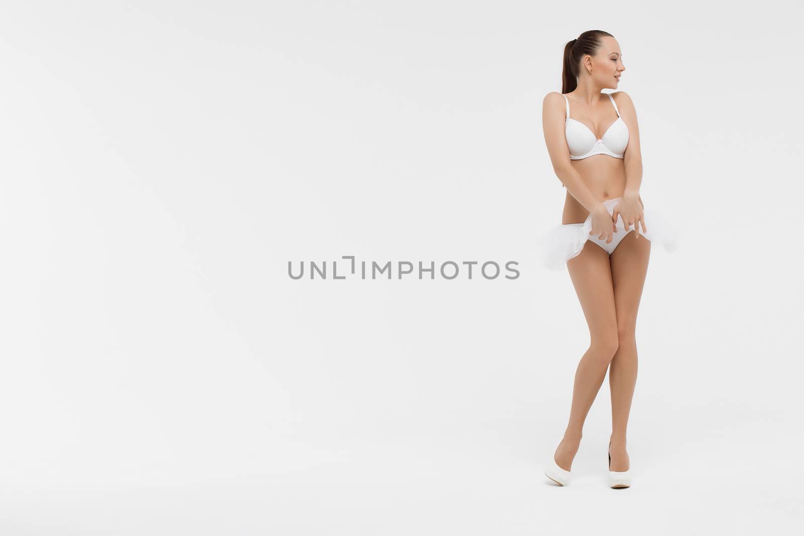 Beautiful sporty woman body. Sexy female slim tanned girl by 3KStudio