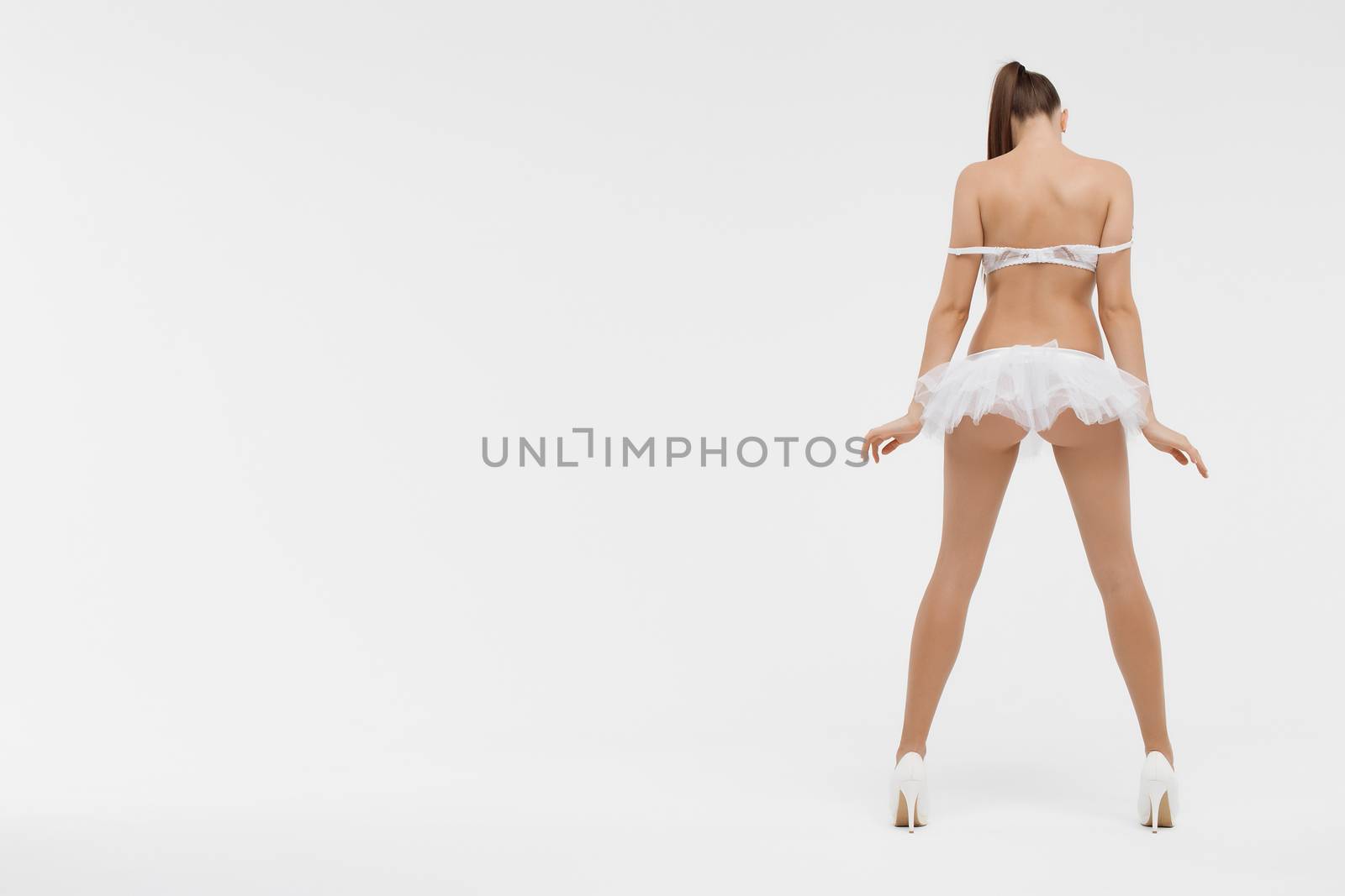 Beautiful sporty woman body. Sexy female slim tanned girl by 3KStudio