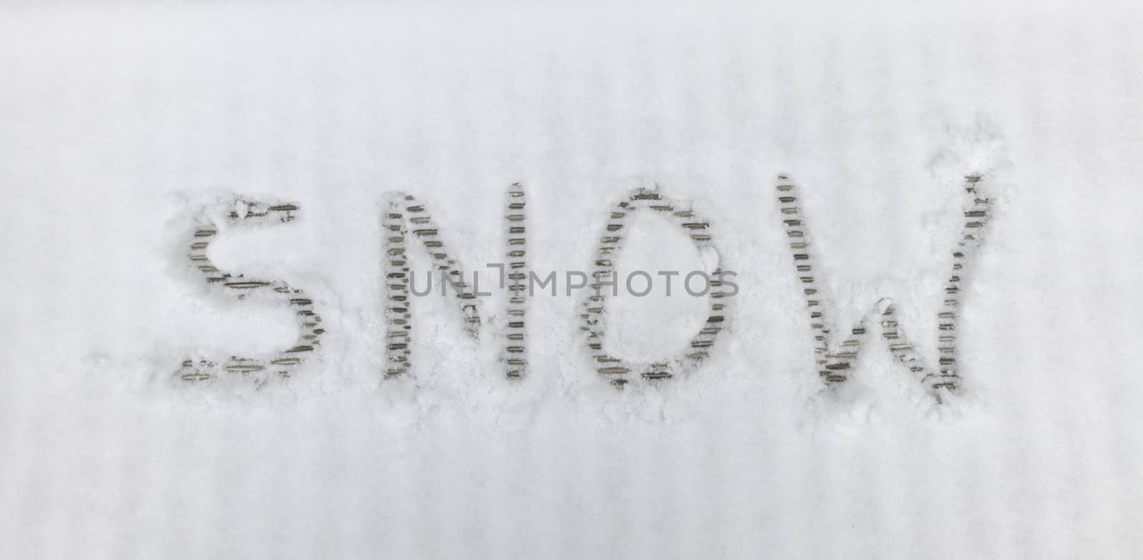 handwriting text letters snow in winter landscape in the white snow