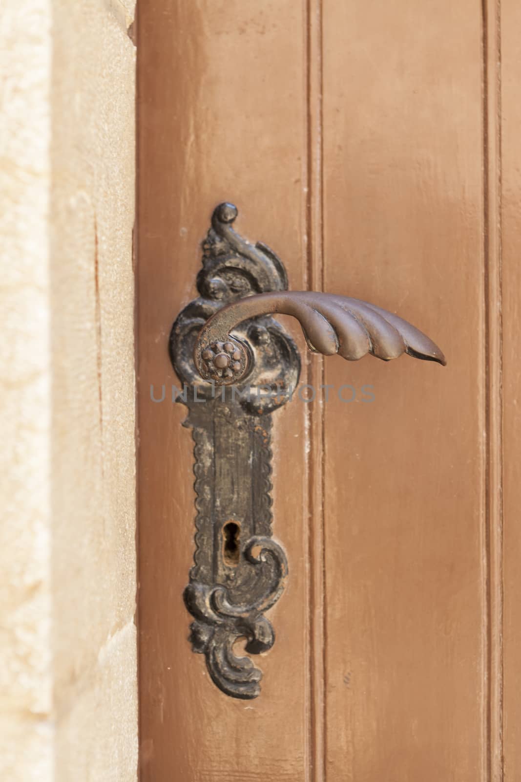 Ancient metal ornated church door handle