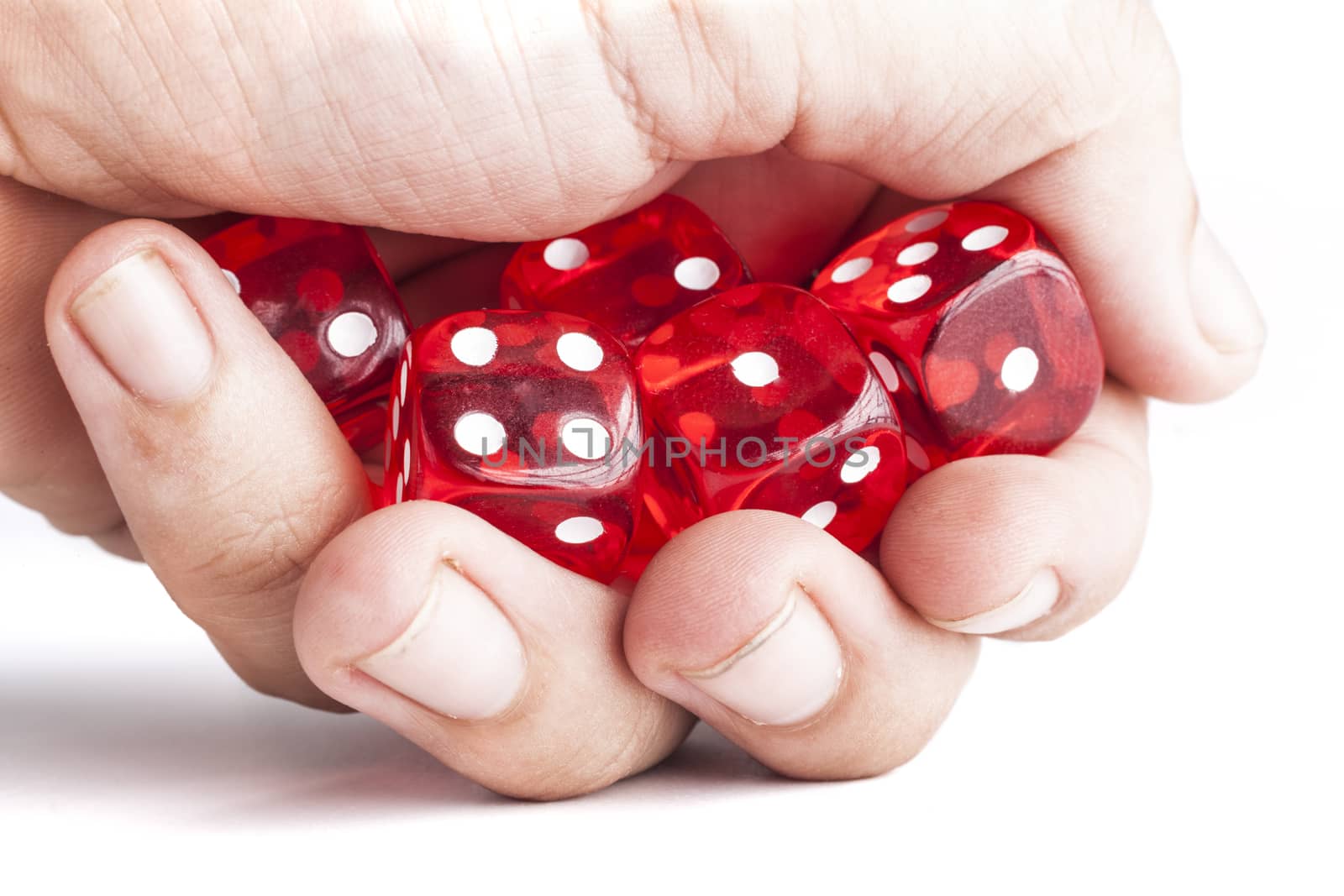 Hand holding red dices isolated on white background