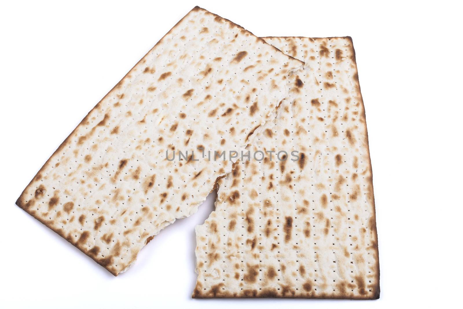 Broken  Jewish traditional Pesach textured Matza bread substitute isolated on white background