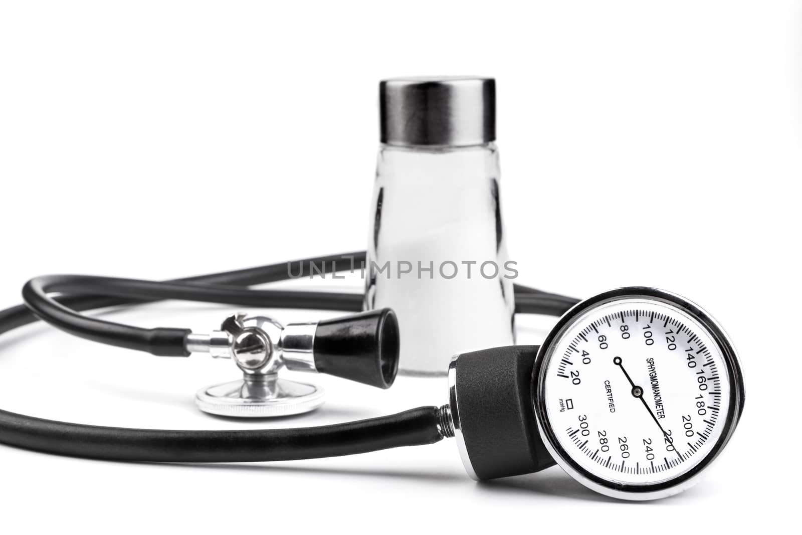 Salt an blood pressure tools isolated on white background