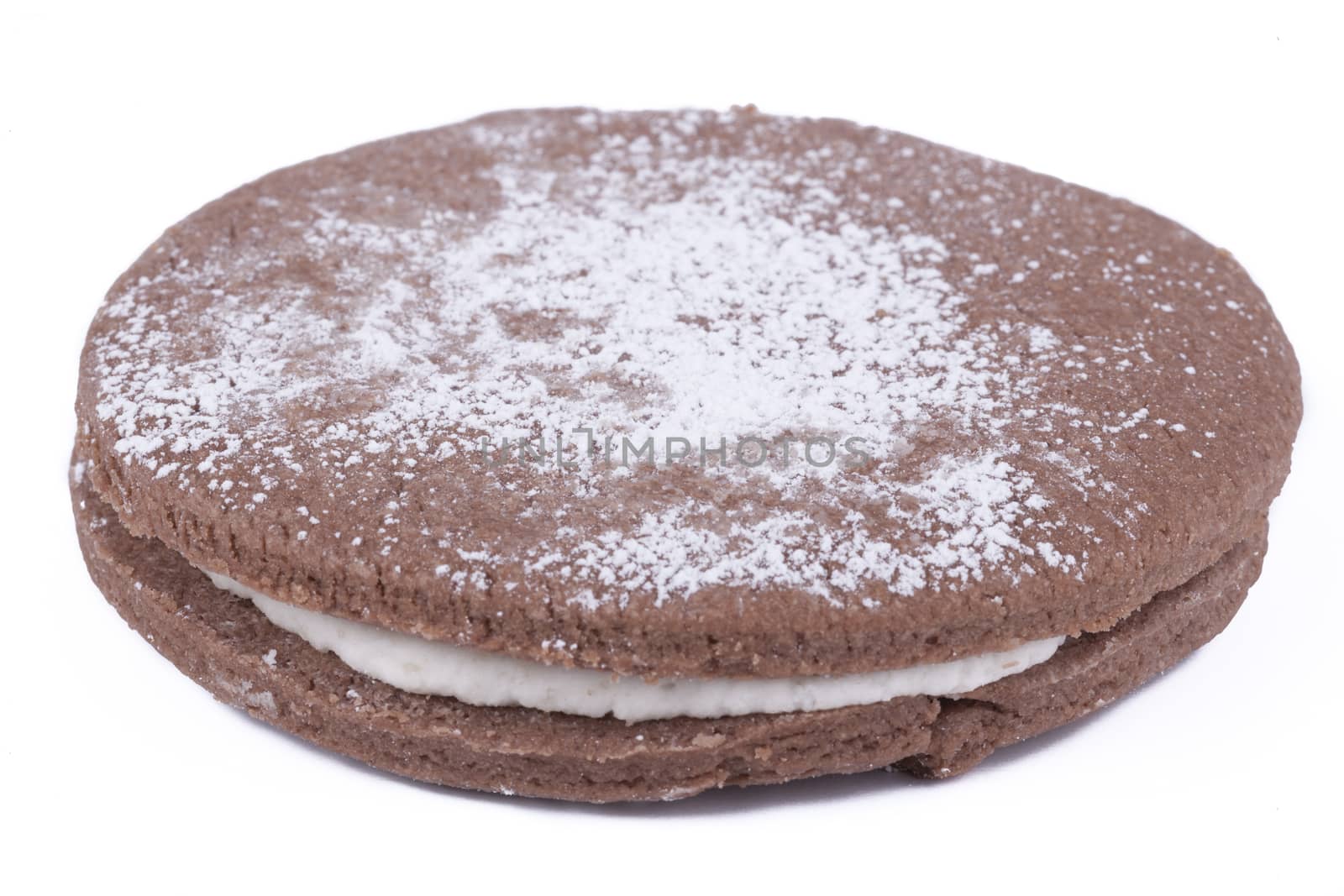 Big round cookie isolated on white background with shugar powder on top