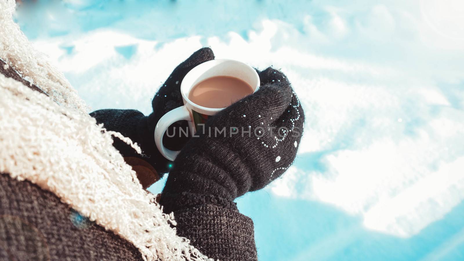 Warm cup of hot coffee warming in the hands of a girl by natali_brill