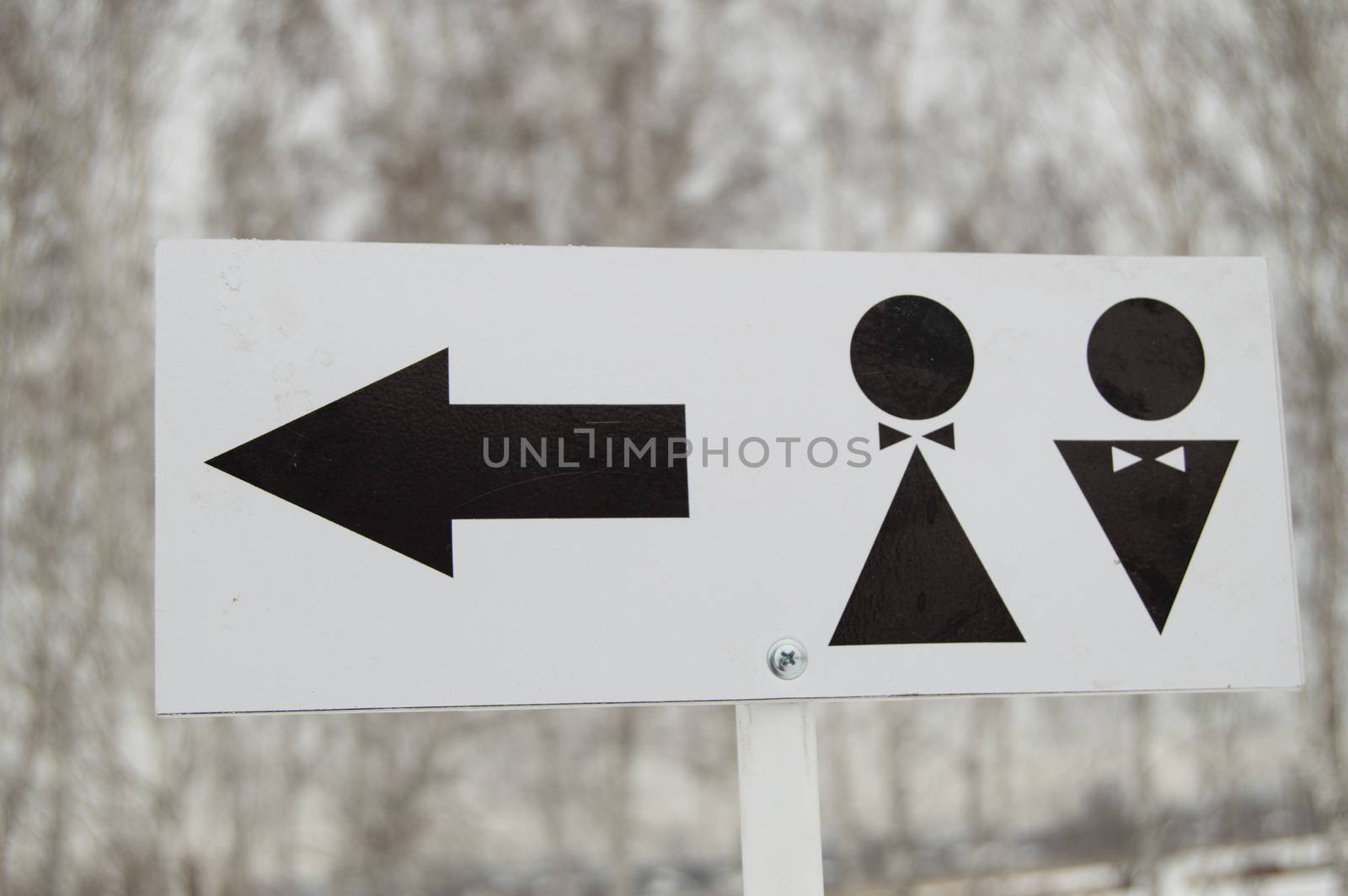 A pointer to a public toilet and the sign of a man and a woman. Hygiene in the Park, outdoor by claire_lucia