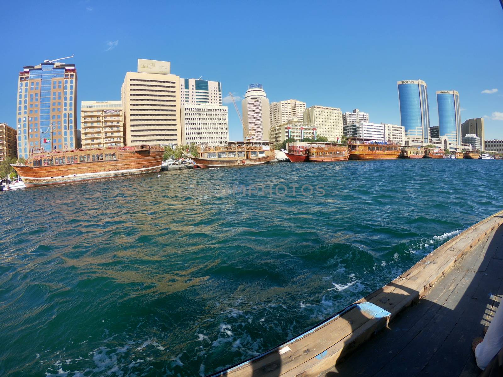 Skyline View of Dubai Creek with Traditonal Fishing Boats and Buildings. Located in the Gulf Of Dubai. by sn040288