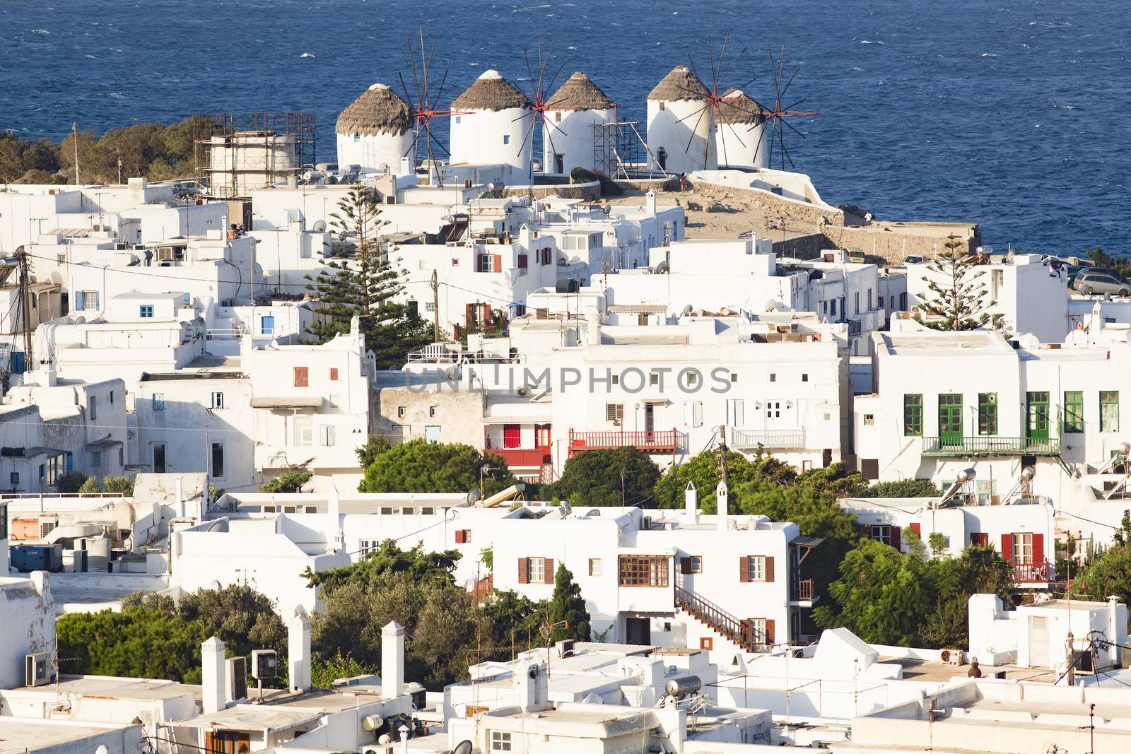 panoramic view of the Mykonos town harbor from the above hills on a sunny summer day, Mykonos, Cyclades, Greece