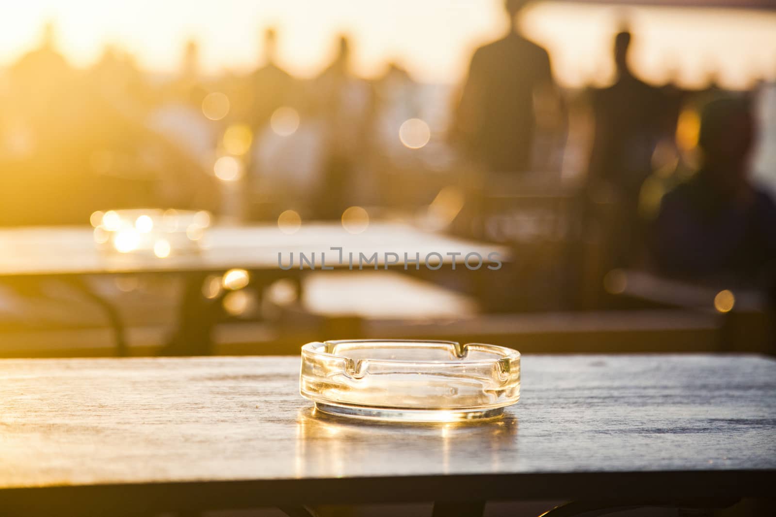 sunset bar by the beach - focus on table