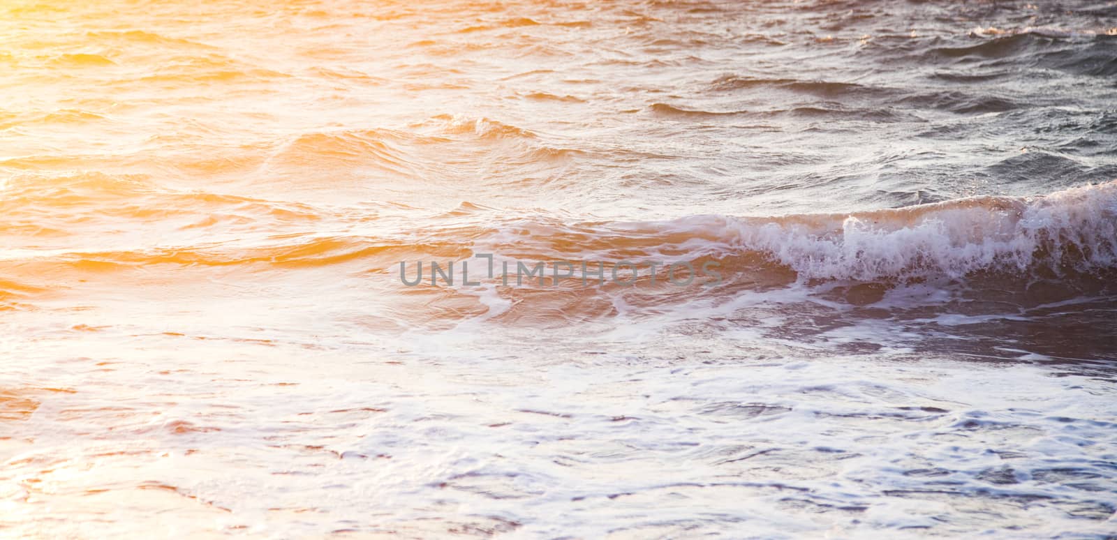 beautiful sea waves at sunset -  beach holiday background