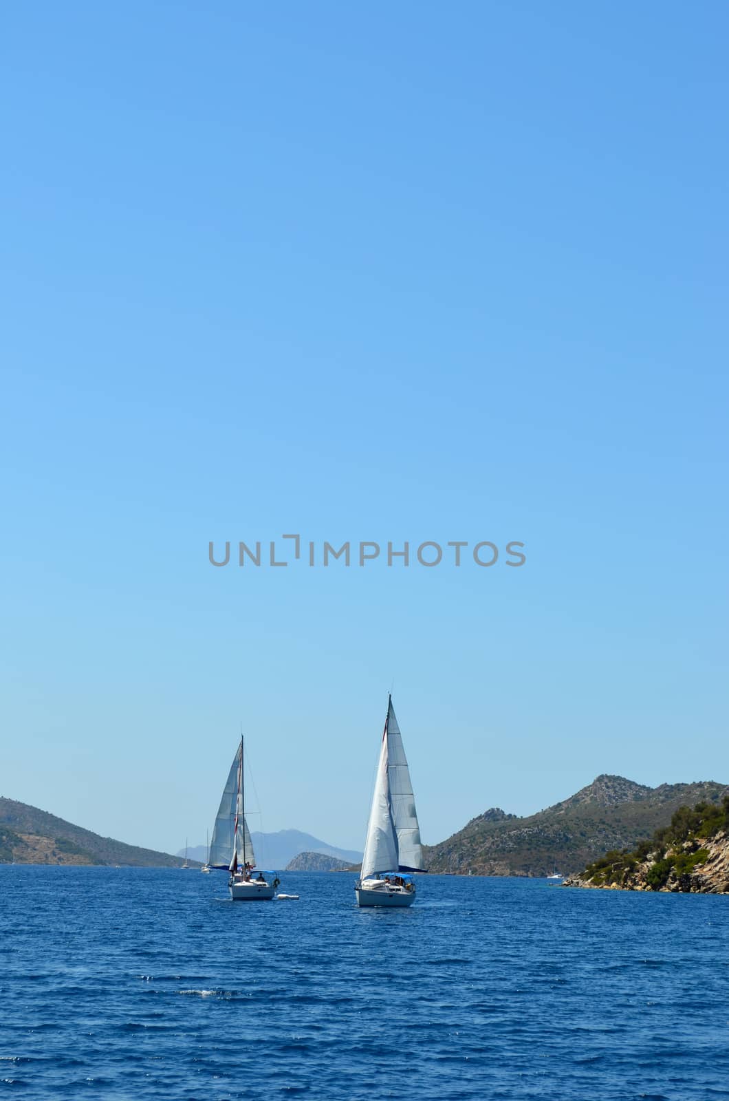 Sailing luxury boats participate in sail yacht regatta in the Aegean Sea in Turkey