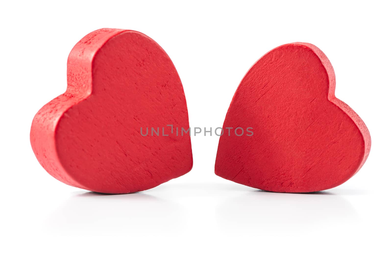 Two red wooden hearts isolated on white by starush