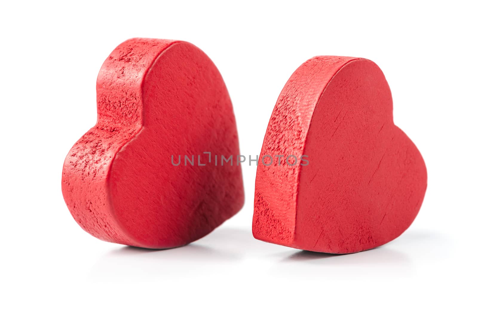 Two red wooden hearts isolated on white by starush