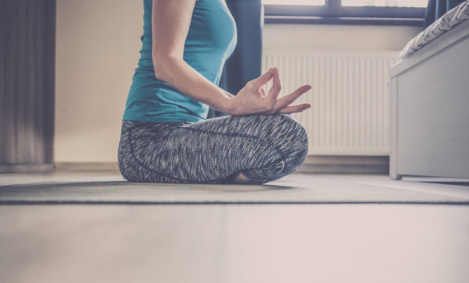 woman doing yoga at home