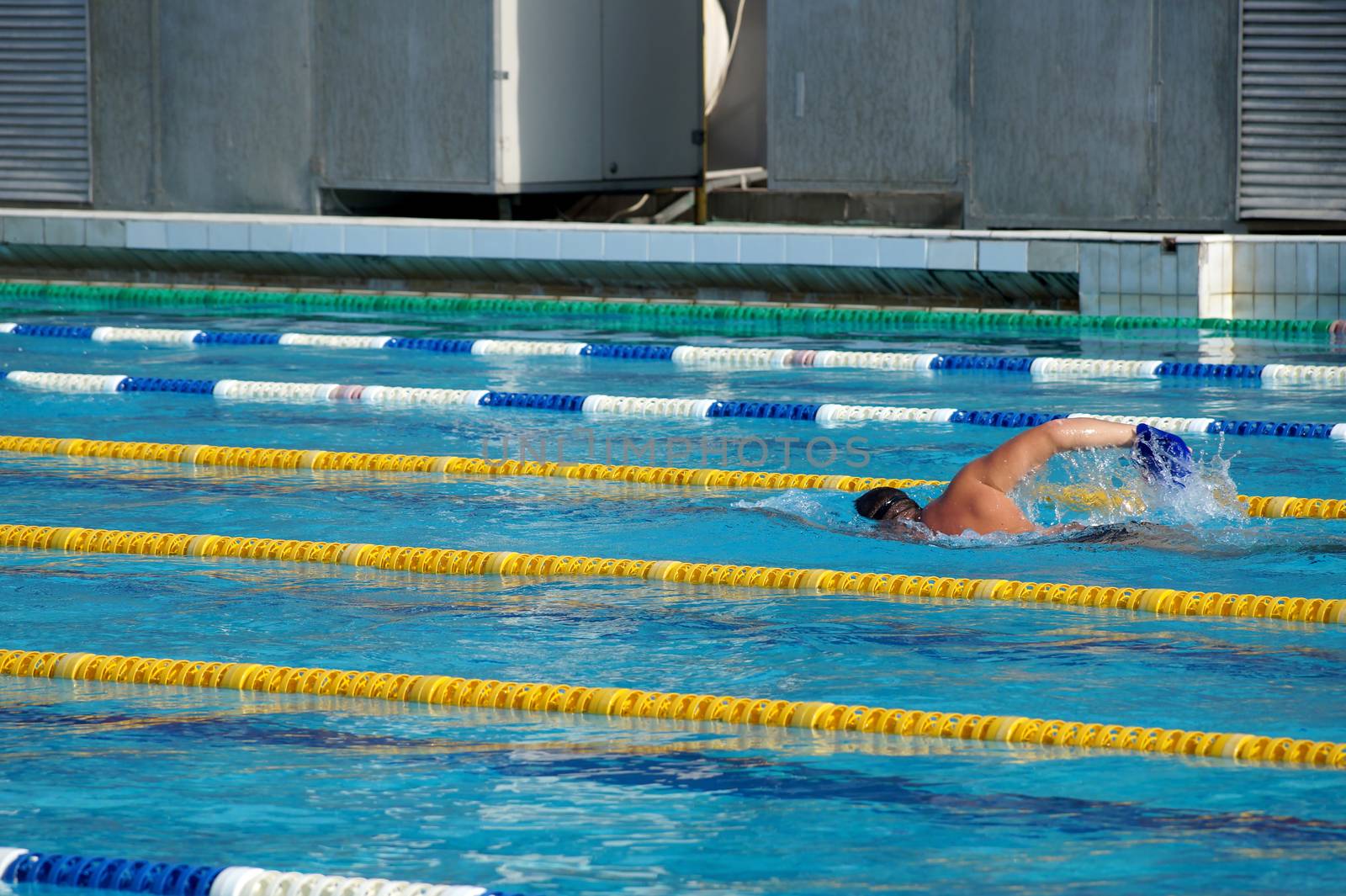Swimmer in the big outdoor swimming pool
