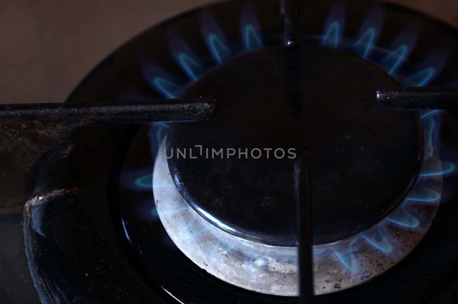 The burning gas ring on the stove