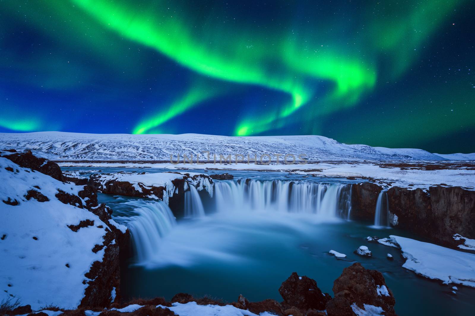 Northern Light, Aurora borealis at Godafoss waterfall in winter, Iceland. by gutarphotoghaphy