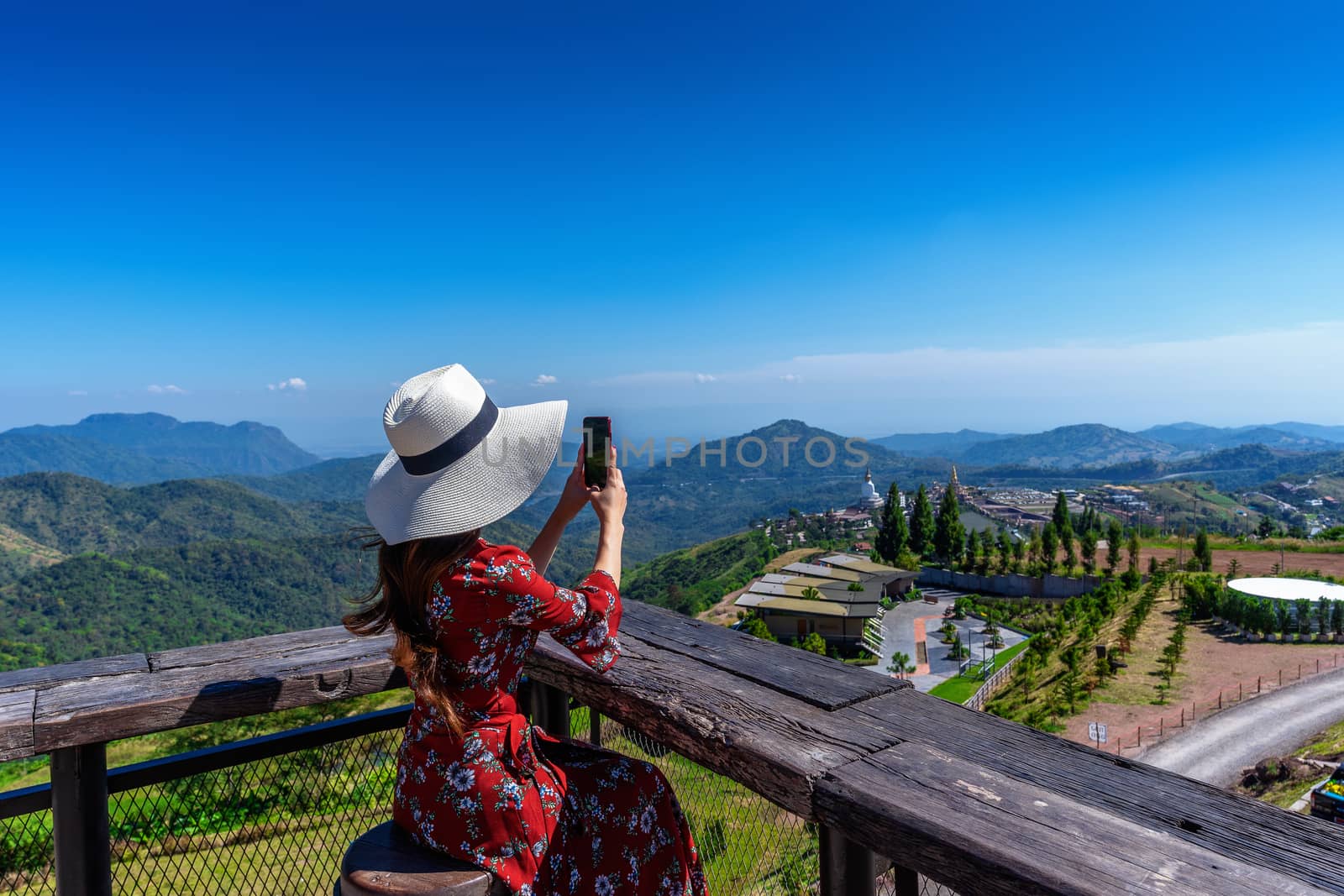 woman take photo to landscape of khao kho, Thailand. by gutarphotoghaphy