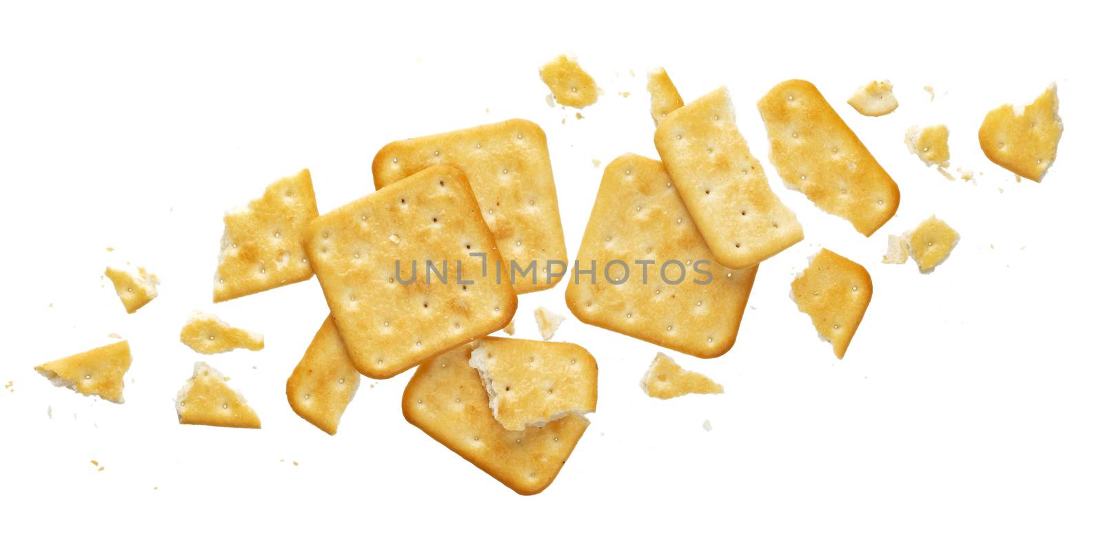 Broken cracker isolated on white background. Crushed dry cracker cookies isolated with clipping path, top view