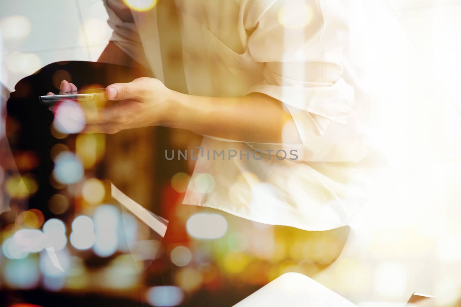 Double exposure of Phone on hands.