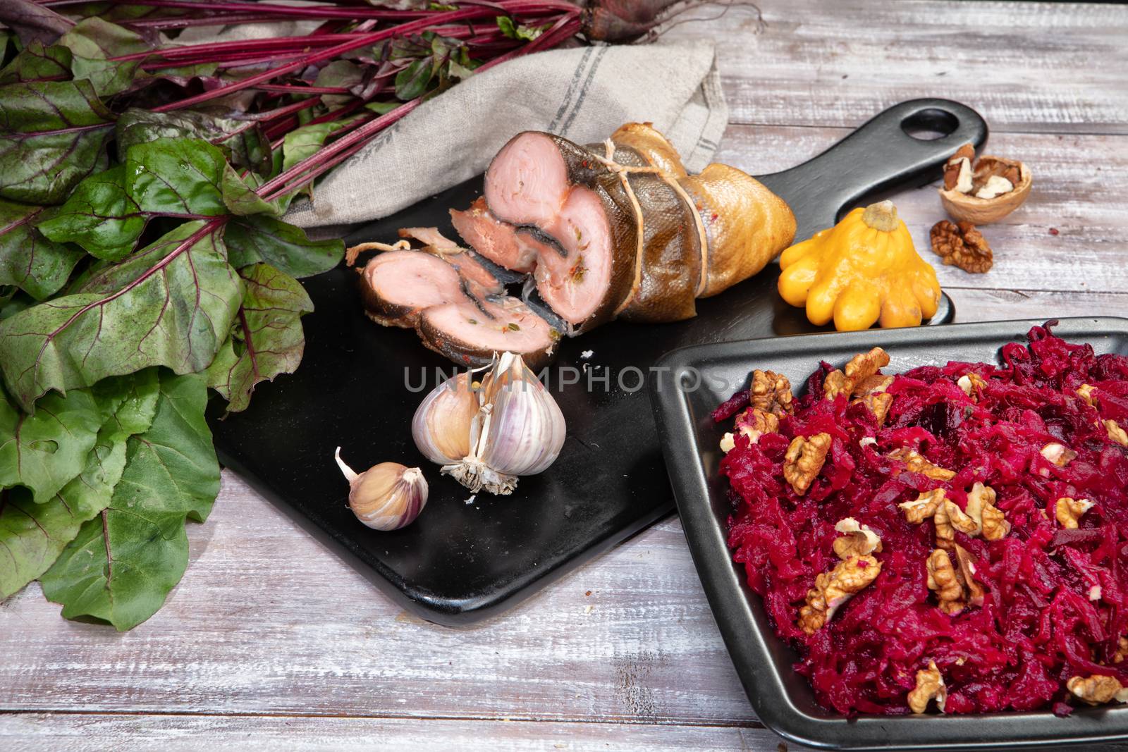 Meat and vegetables on an old wooden background