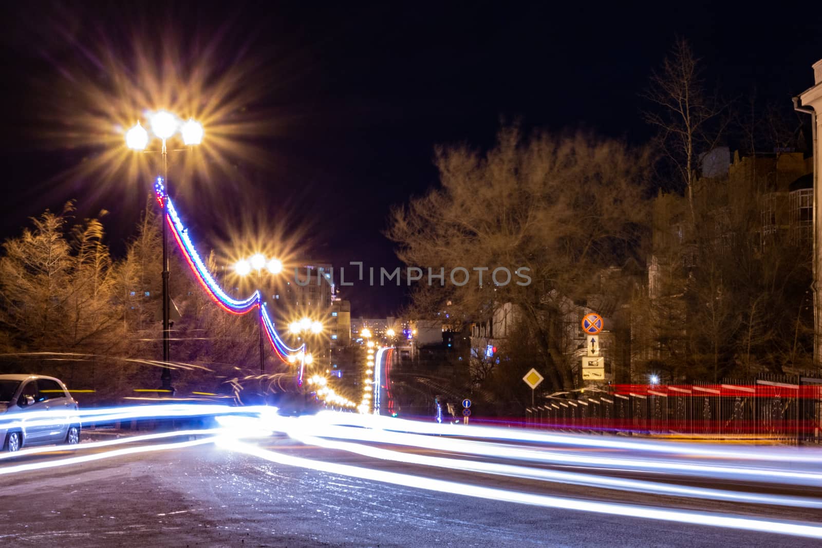 Evening view of the city of Khabarovsk in winter. Urban landscape. In the Windows of the houses light.