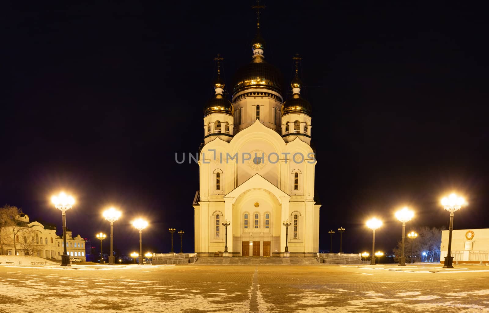 The Cathedral is illuminated by lamps at night.