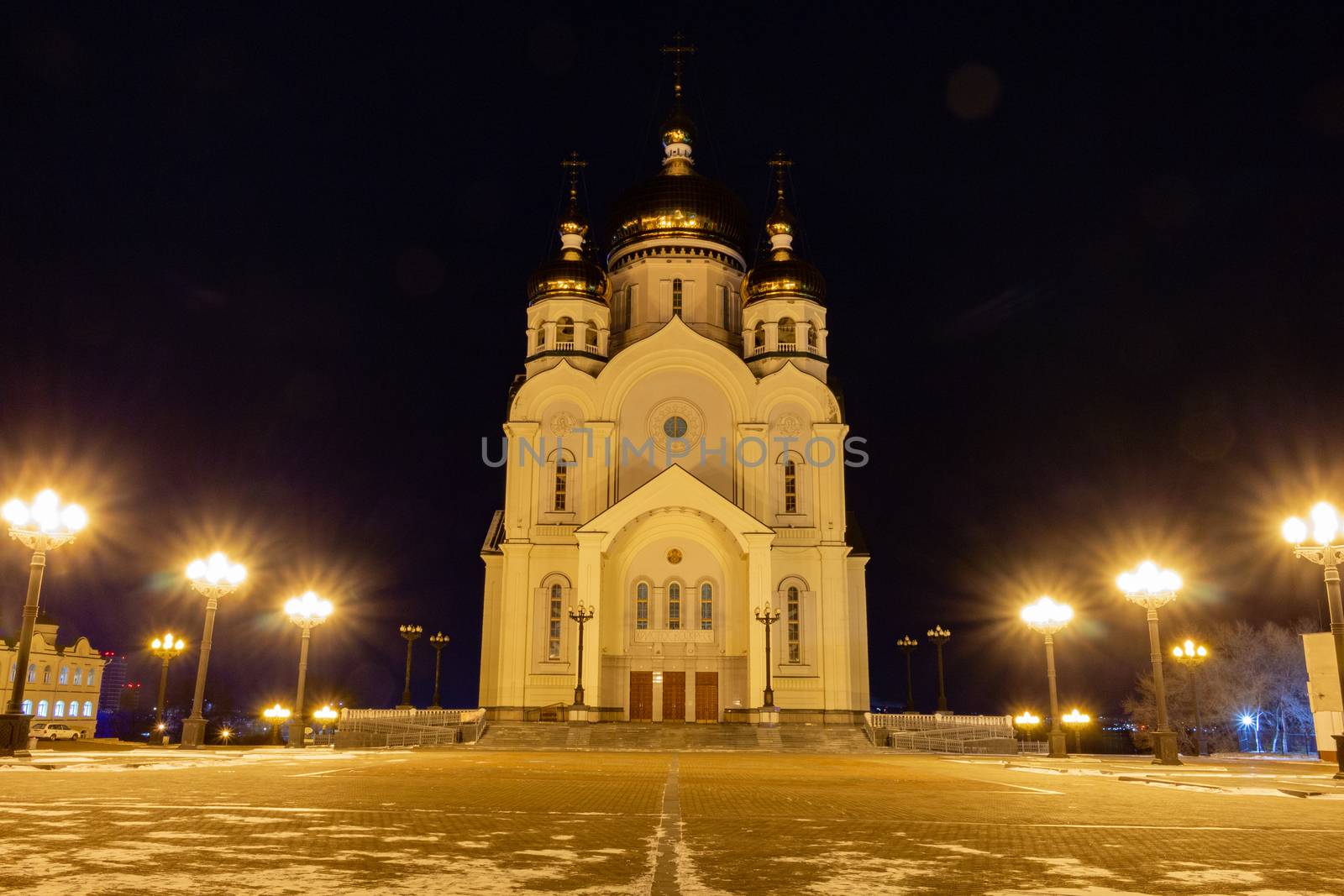 The Cathedral is illuminated by lamps at night.
