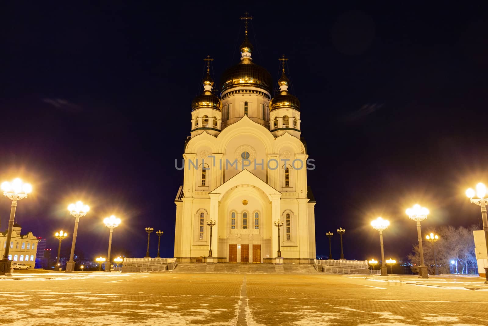 The Cathedral is illuminated by lamps at night.