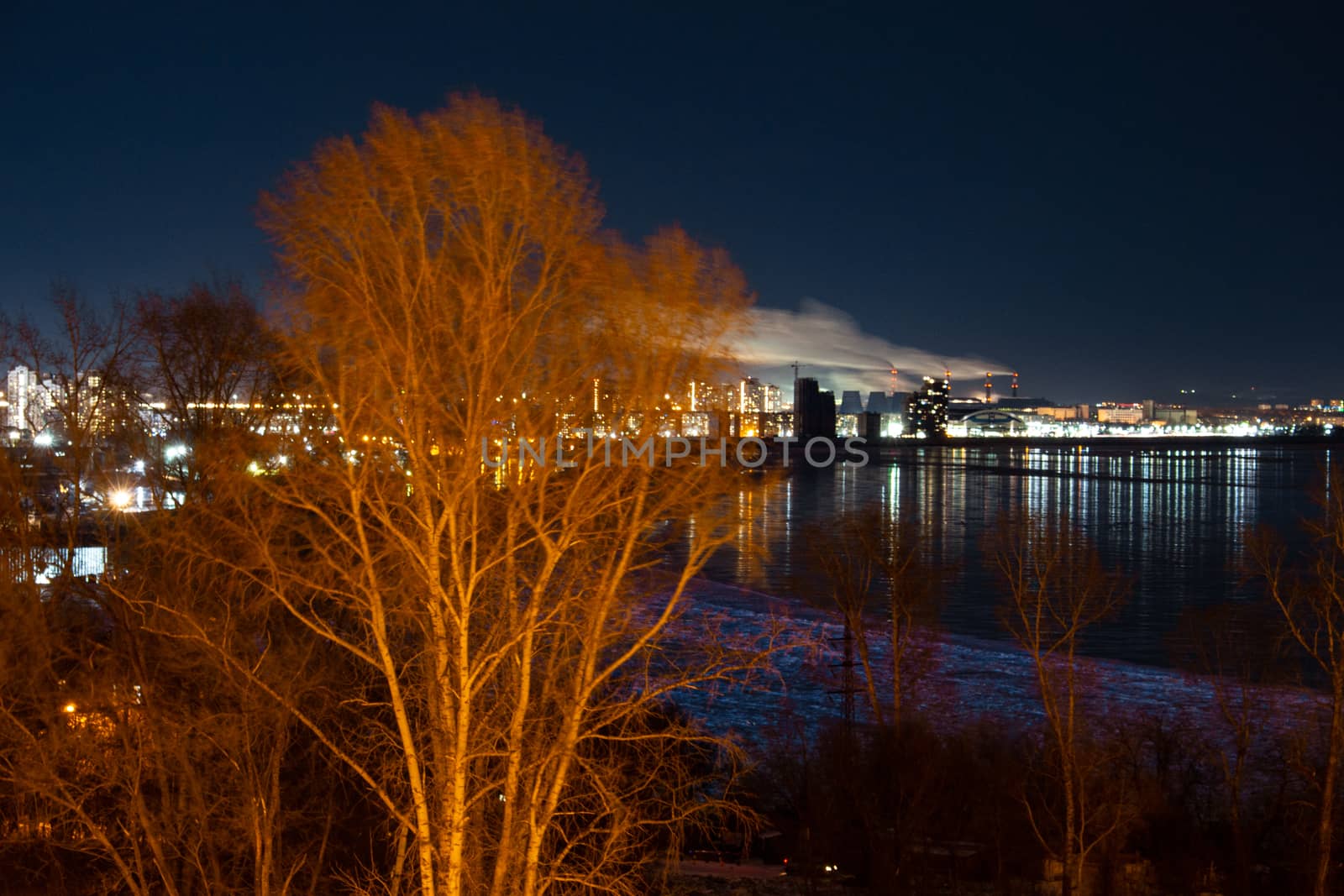 Evening view of the city of Khabarovsk in the winter. The ice on the Amur river.