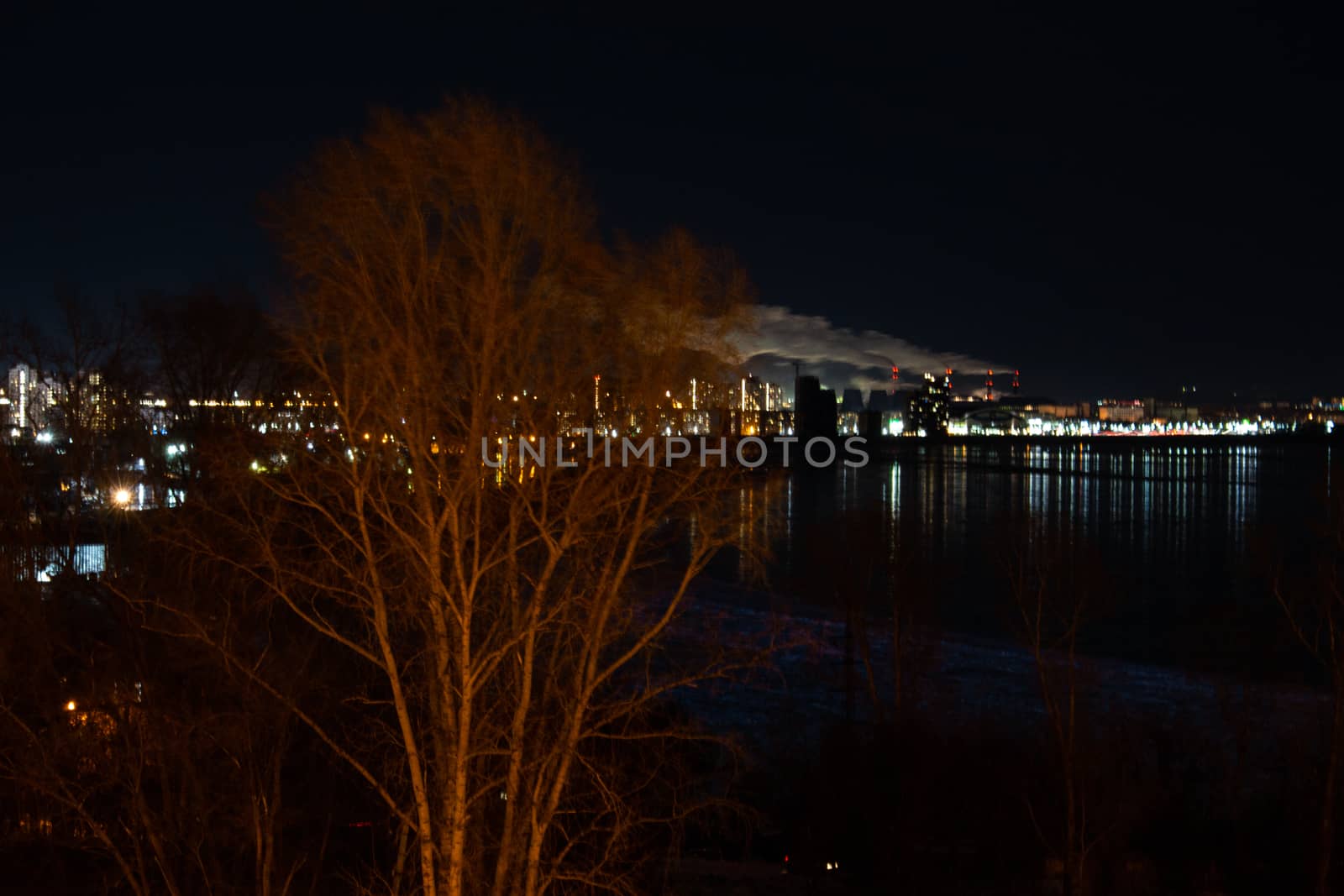 Evening view of the city of Khabarovsk in the winter. The ice on the Amur river.