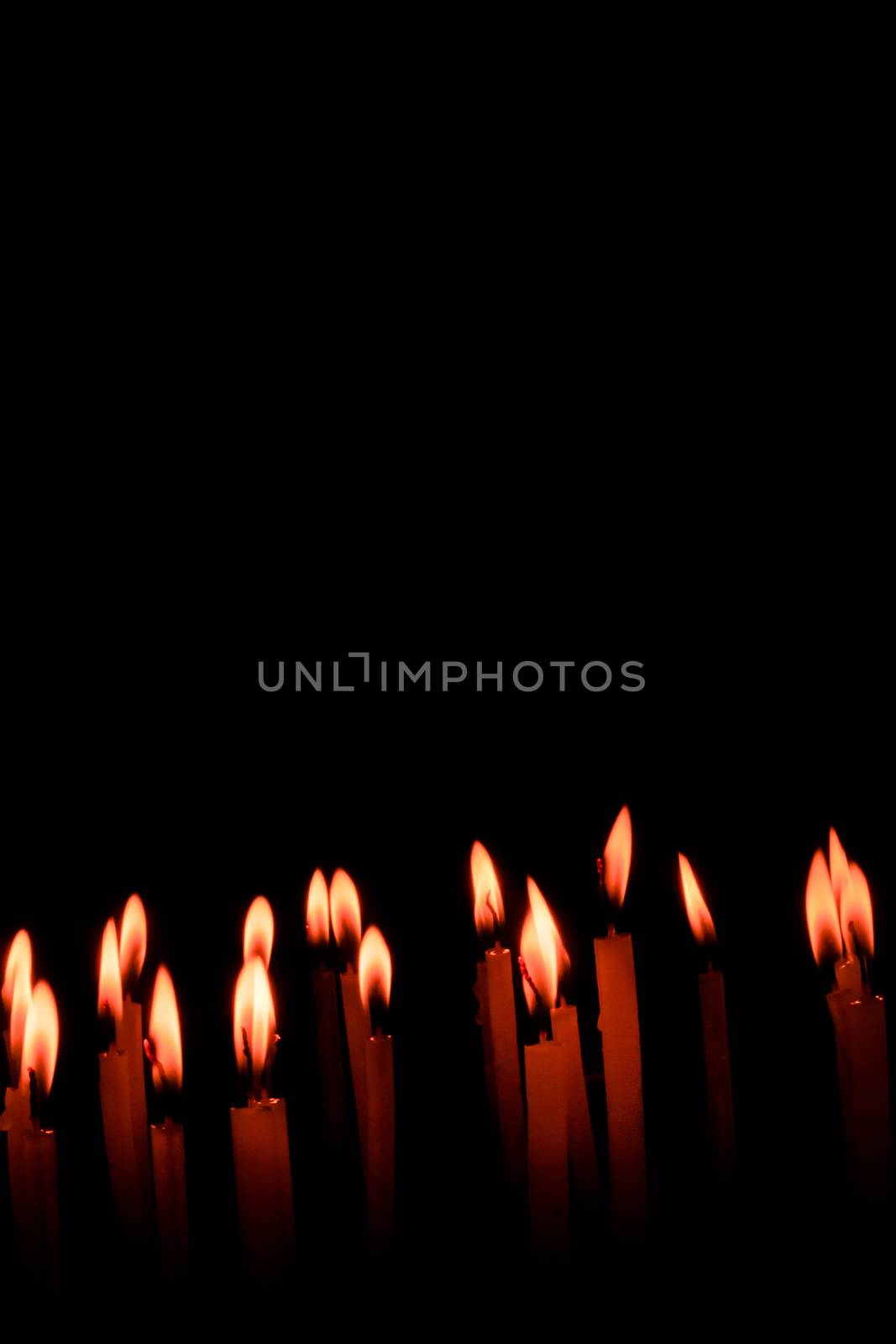 Candle flame set isolated in black background. by sudiptabhowmick