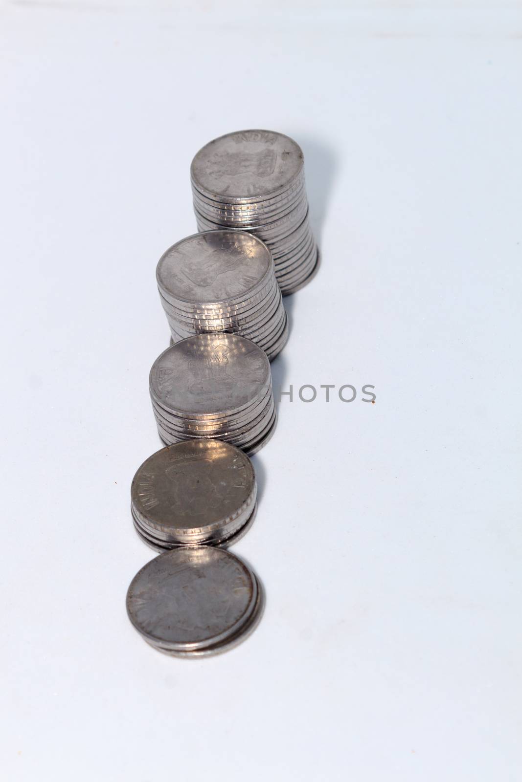 Stock pile 2 two Indian rupee metal coin currency on isolated white background. Financial, economy, investment growth concept. Banking and exchange object. closeup. by sudiptabhowmick