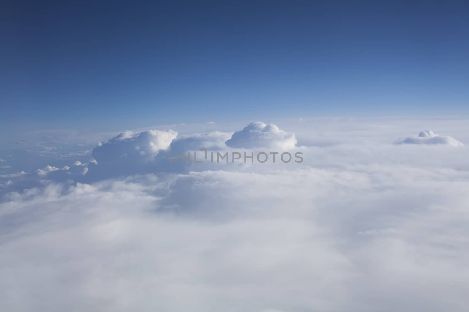 Flying over white  clouds with blue sky aerial shot