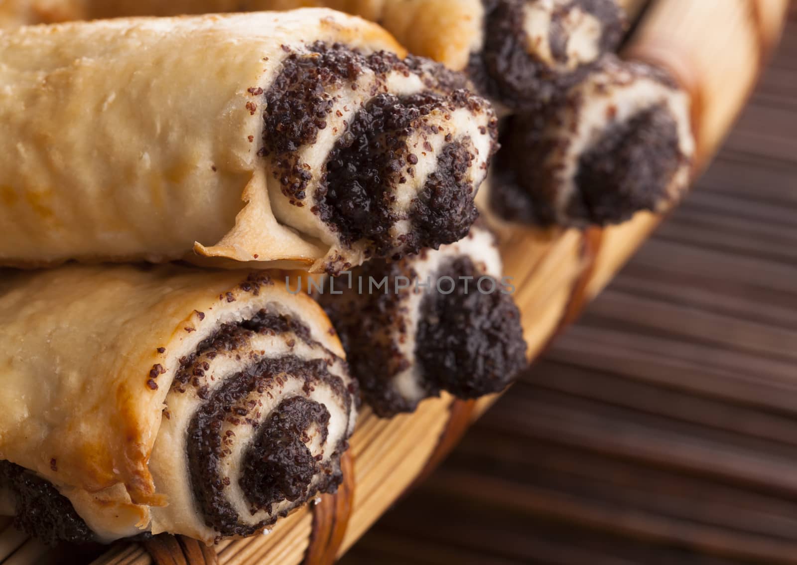 Croissant filled with chocolate closeup on wood background