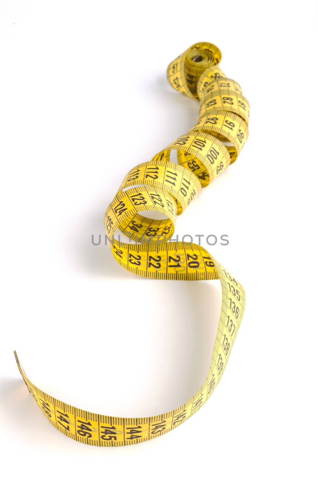 Long Yellow  measuring tape close-up isolated on white background