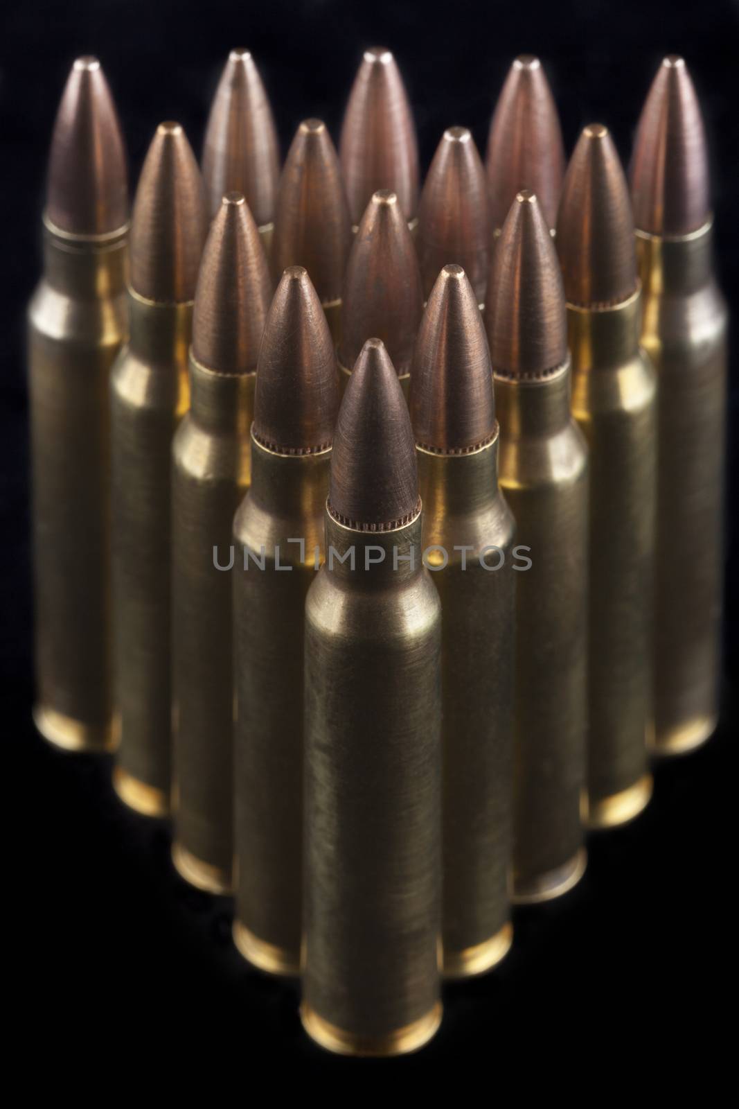 Rifle bullets close-up on black background