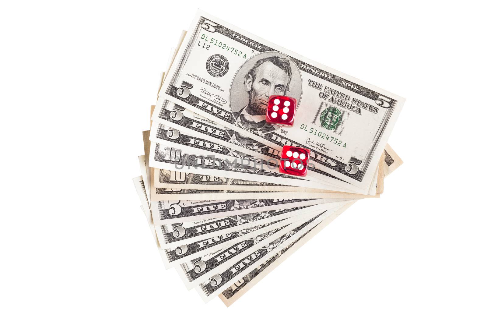 Pair of red dice showing 6 on dollar banknotes isolated on white