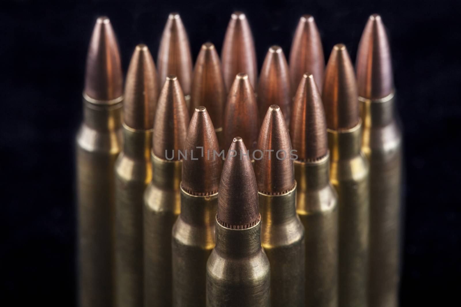 Rifle bullets close-up on black background