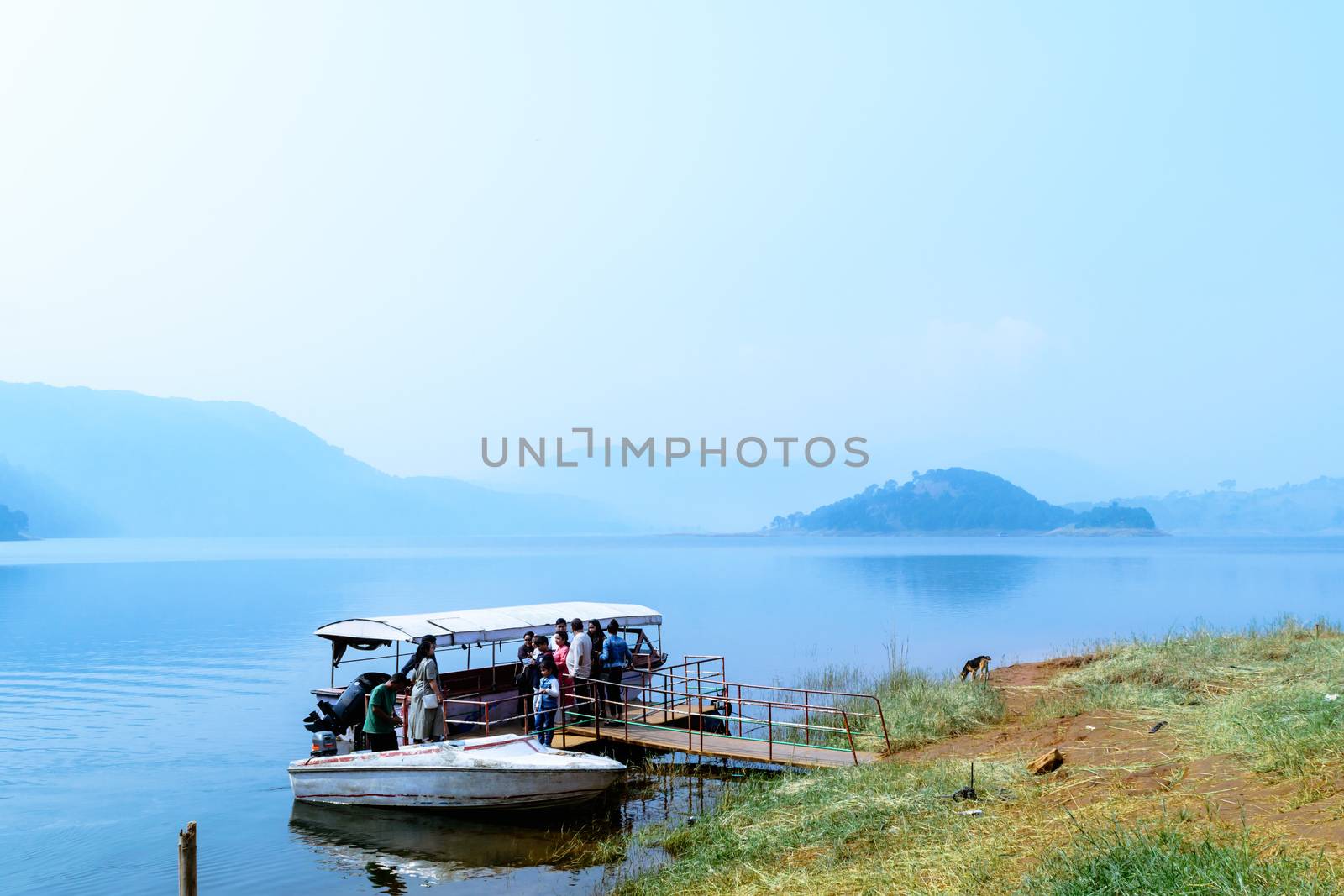 Umiam lake, shillong, Assam, India, December 15, 2017: Indian tourists people enjoying on travel holiday cruise boat tour. by sudiptabhowmick